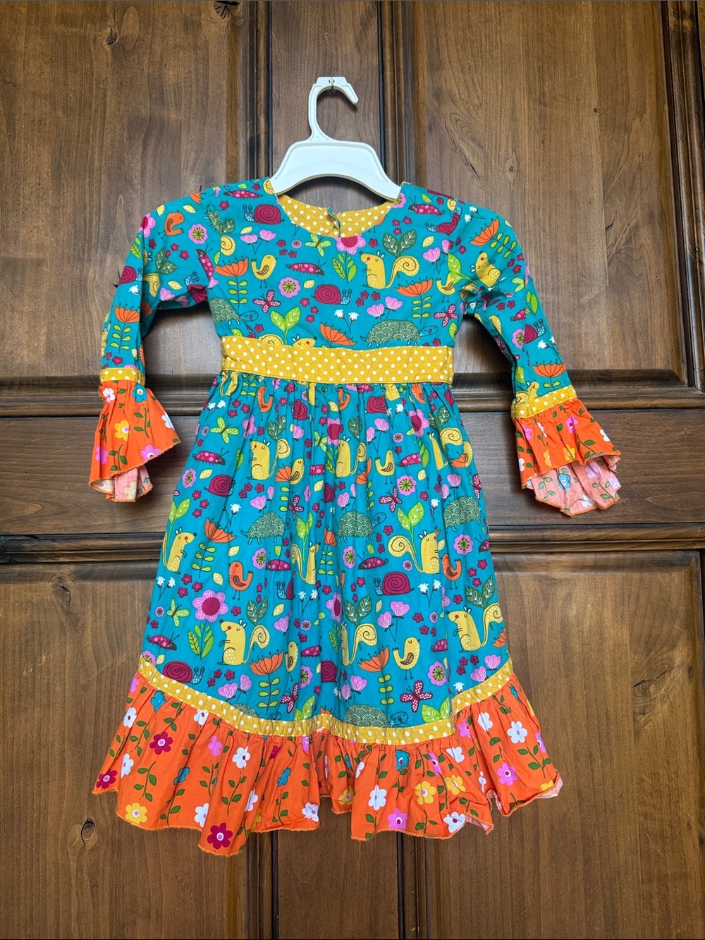 Jelly The Pug Teal Dress with Orange Ruffle Accents